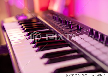 Part of piano keyboard with black and white keys, buttons and many sliders Part of piano keyboard with black and white keys, buttons and many sliders 67358654