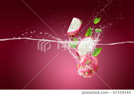 Water Splashing on Dragon Fruit or Pitaya over 67359349