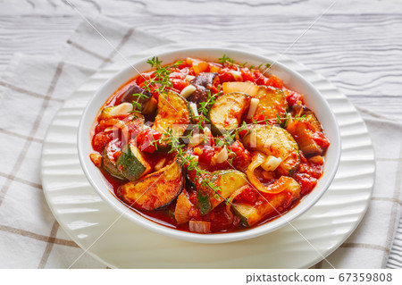 veggies stew in a white bowl 67359808
