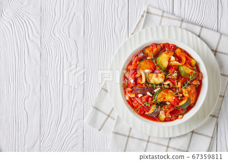hot veggies ragout in a white bowl 67359811