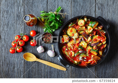 eggplant, onion, zucchini with spicy tomato sauce 67359814