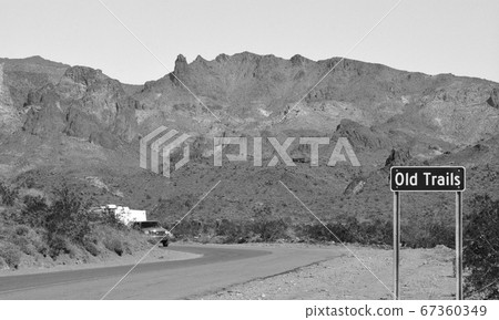 Ghost Town of Old Trails Sign on Route 66 in the Sonoran Desert, Arizona USA in Black and White Ghost Town of Old Trails Sign on Route 66 in the Sonoran Desert, Arizona USA in Black and White 67360349