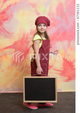 small happy girl chef in hat, apron with 67361132