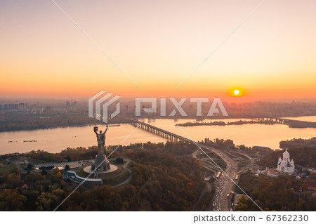 Kiev skyline over beautiful fiery sunset, Ukraine. Monument motherland. Kiev skyline over beautiful fiery sunset, Ukraine. Monument motherland. 67362230