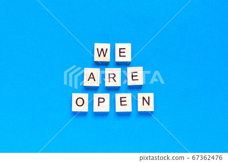 We are open. Wooden cubes with a text message We We are open. Wooden cubes with a text message We 67362476