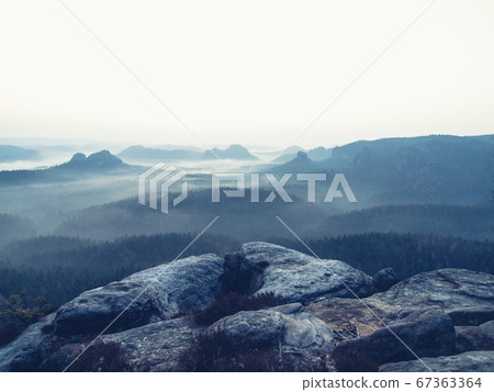 Cracked rocks of Kleiner Winterberg and fog Cracked rocks of Kleiner Winterberg and fog 67363364