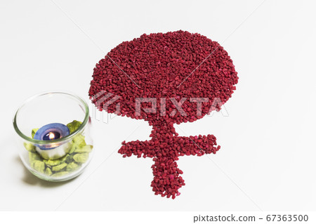 pile of red stones forming the symbol of the woman pile of red stones forming the symbol of the woman 67363500