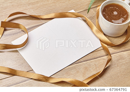 Coffee white cup and paper on wooden background. Coffee white cup and paper on wooden background. 67364791