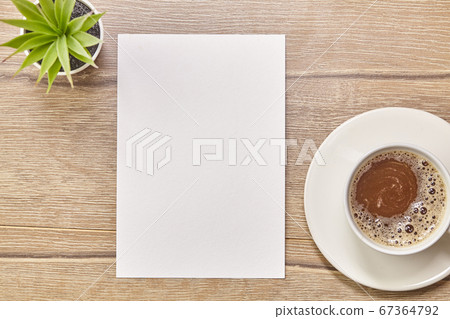 Coffee white cup and paper on wooden background. Coffee white cup and paper on wooden background. 67364792