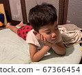 Boy sleeping with a cane 67366454