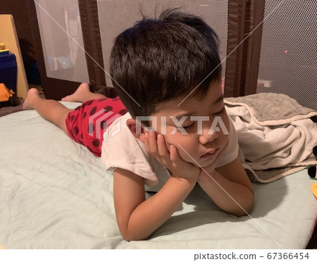 Boy sleeping with a cane Boy sleeping with a cane 67366454