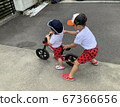 Boy brothers practicing bicycles in the garden 67366656
