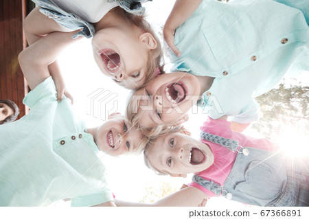 Friends Looking Down Smiling Friends Looking Down Smiling 67366891
