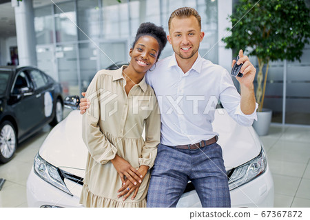 married couple in cars showroom married couple in cars showroom 67367872