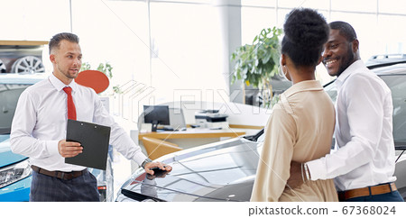 african american married couple came to look at car for future purchase 67368024