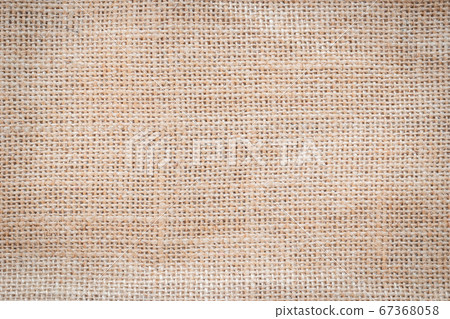 Jute hessian sackcloth woven burlap texture pattern background in old aged yellow beige cream gold brown color 67368058
