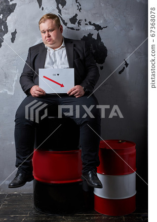 upset caucasian man is saddened by oil prices upset caucasian man is saddened by oil prices 67368078