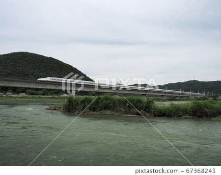Sanyo Shinkansen N700 Series Shinkansen Nozomi across the Chikusa River Bridge Sanyo Shinkansen N700 Series Shinkansen Nozomi across the Chikusa River Bridge 67368241