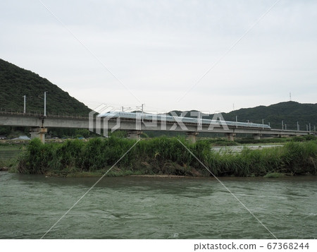 N700 Series Shinkansen Mizuho across the Sanyo Shinkansen Chikusa River Bridge N700 Series Shinkansen Mizuho across the Sanyo Shinkansen Chikusa River Bridge 67368244