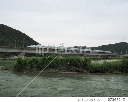 N700 Series Shinkansen Mizuho across the Sanyo Shinkansen Chikusa River Bridge N700 Series Shinkansen Mizuho across the Sanyo Shinkansen Chikusa River Bridge 67368245