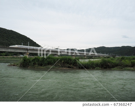 Sanyo Shinkansen N700 Series Shinkansen Nozomi across the Chikusa River Bridge Sanyo Shinkansen N700 Series Shinkansen Nozomi across the Chikusa River Bridge 67368247