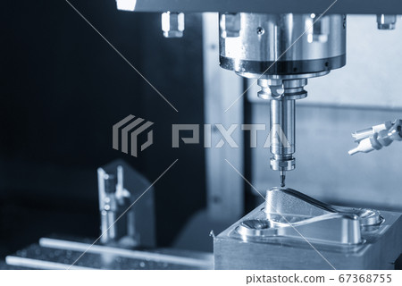 The CNC milling machine cutting the mold parts. The CNC milling machine cutting the mold parts. 67368755