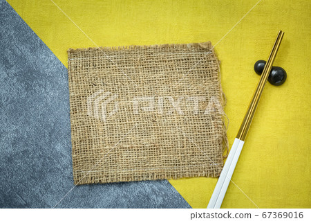 piece of sack with golden chopstick for food piece of sack with golden chopstick for food 67369016