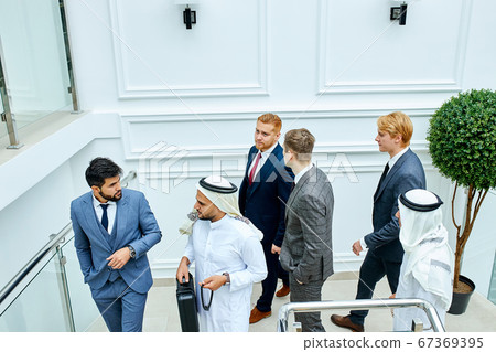 Sheikh and caucasian man speak Sheikh and caucasian man speak 67369395