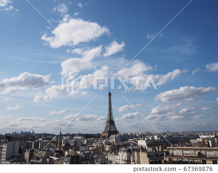Paris cityscape with an impressive Eiffel Tower that shines under the clear blue sky 67369876