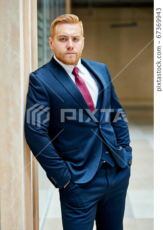 Inflated caucasian man in tuxedo outdoors 67369943