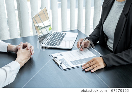 Office executives are interviewing job applicants in the meeting room Office executives are interviewing job applicants in the meeting room 67370163