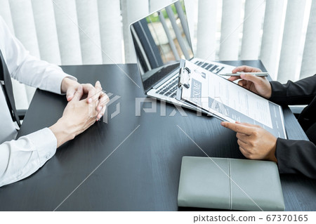 Office executives are interviewing job applicants in the meeting room Office executives are interviewing job applicants in the meeting room 67370165
