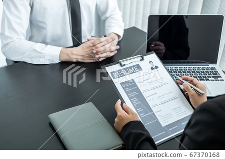Office executives are interviewing job applicants in the meeting room Office executives are interviewing job applicants in the meeting room 67370168