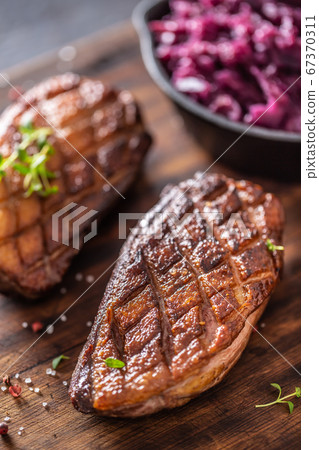 Detail of tasty roasted duck breasts and stewed Detail of tasty roasted duck breasts and stewed 67370311