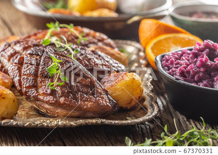 Fresh grilled duck breasts served with roasted 67370331