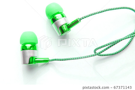 Close-up of green portable headphones for smart Close-up of green portable headphones for smart 67371143