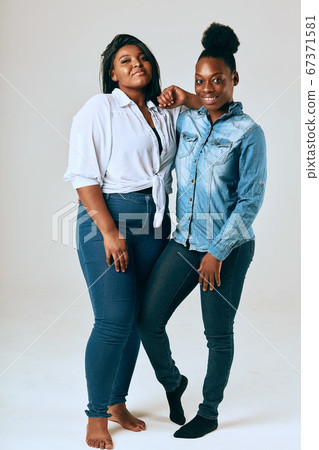 Two College Friends Smiling and Looking at the Camera Two College Friends Smiling and Looking at the Camera 67371581
