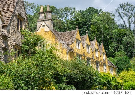 Castle Combe is a village and civil parish within the Cotswolds Area of Natural Beauty in Wiltshire. England, UK, July 11, 2020 67371685