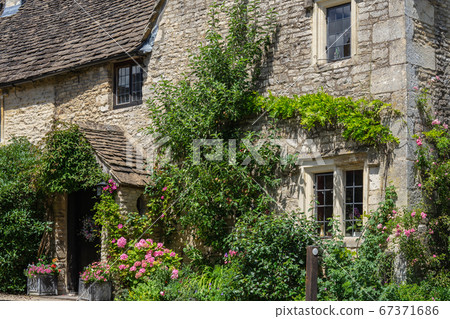 Castle Combe is a village and civil parish within the Cotswolds Area of Natural Beauty in Wiltshire. England, UK, July 11, 2020 Castle Combe is a village and civil parish within the Cotswolds Area of Natural Beauty in Wiltshire. England, UK, July 11, 2020 67371686