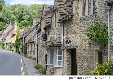 Castle Combe is a village and civil parish within the Cotswolds Area of Natural Beauty in Wiltshire. England, UK, July 11, 2020 67371693