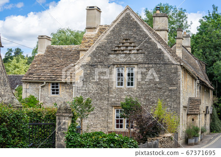 Castle Combe is a village and civil parish within the Cotswolds Area of Natural Beauty in Wiltshire. England, UK, July 11, 2020 67371695
