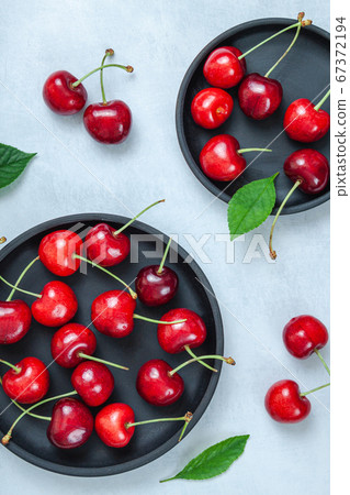 Cherry with leaf on plate and water dropsand on Cherry with leaf on plate and water dropsand on 67372194