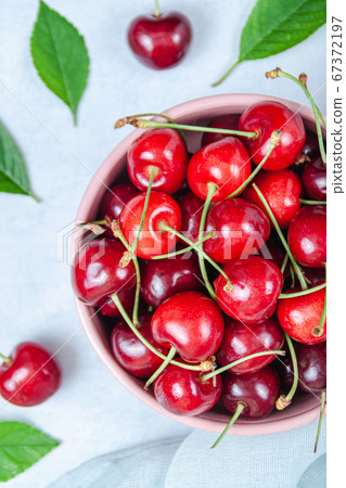 Cherry with leaf on plate and water dropsand on Cherry with leaf on plate and water dropsand on 67372197