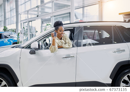 young african woman fulfilled her dream, bought a car 67373135