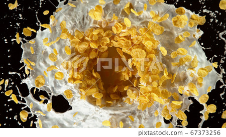 Freeze motion of rotating cereal pieces with milk 67373256