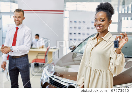 portrait of happy woman with car keys in hands portrait of happy woman with car keys in hands 67373920