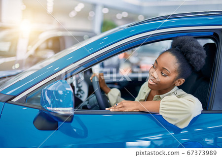 attractive afro woman dreams about new car attractive afro woman dreams about new car 67373989