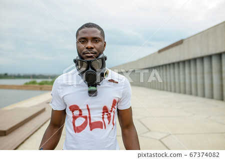 portrait of black man in gas mask, blm concept portrait of black man in gas mask, blm concept 67374082