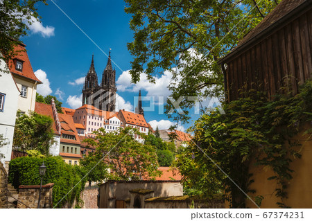 Medieval Meissen old city with beautiful Albrechtsburg Castle on hill. Dresden, Saxony, Germany. Sunny Day in Spring season 67374231
