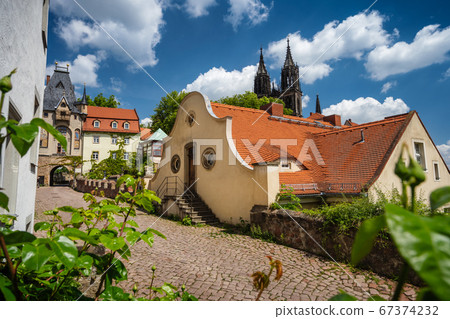 Fable fairy tale Meissen old town. Beautiful Albrechtsburg Castle. Old orange tiled roof buildings. Dresden, Saxony, Germany. Sunny Day 67374232